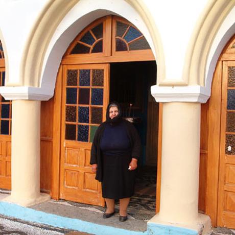 Woman on the threshold of a church at Assomatos settlement, ASSOMATOS (Settlement) KOS