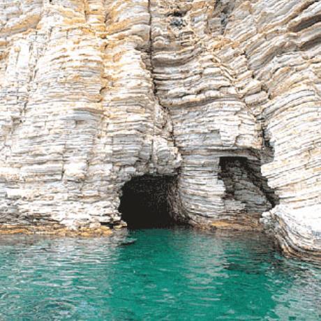 Kastos, a bit north from the port is a small cave with a sandy beach inside, an old shelter of seals, KASTOS (Village) IONIAN ISLANDS