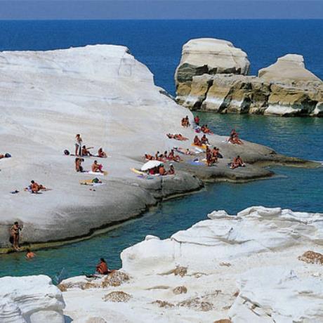 Sarakiniko beach, swimmers & people sunbathing on rocks, SARAKINIKO (Beach) MILOS