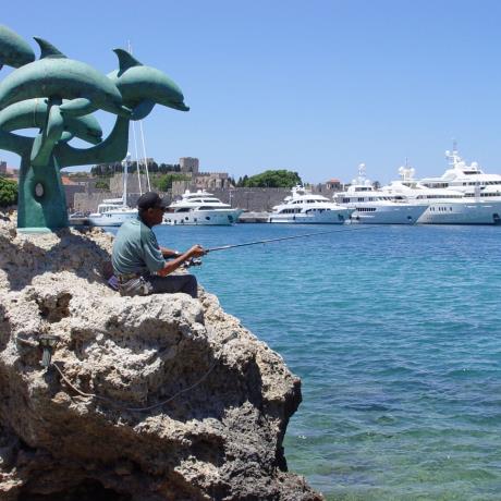 Dolphins statue at the Rodos port, RHODES (Town) DODEKANISSOS