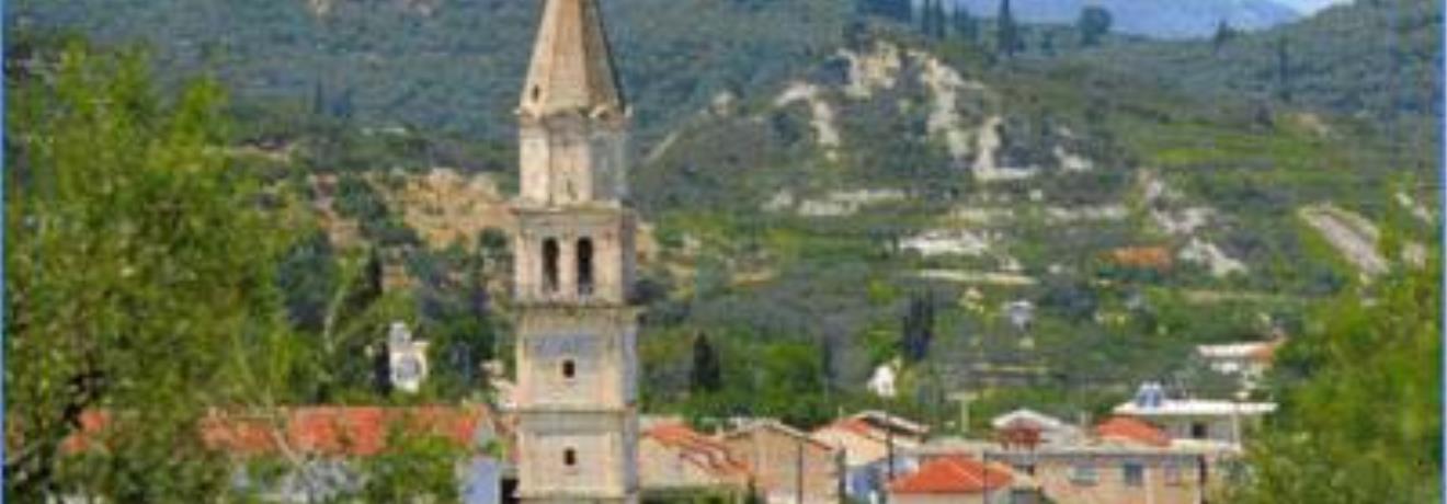 The high campanile of the church of Hypapanti dominates the village