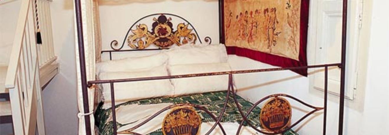 Milos Folk Arts Museum; a bed decorated with needlework